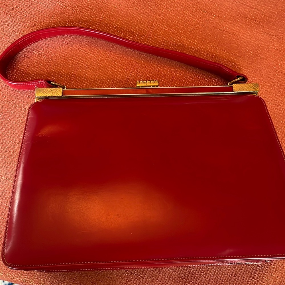 Red clutch made of genuine leather